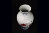 Vintage Japanese porcelain vase with flowering branch pattern in blue, red, green